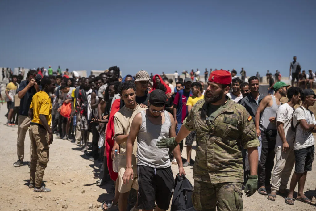 Migrants on the beach near the CETI in Ceuta