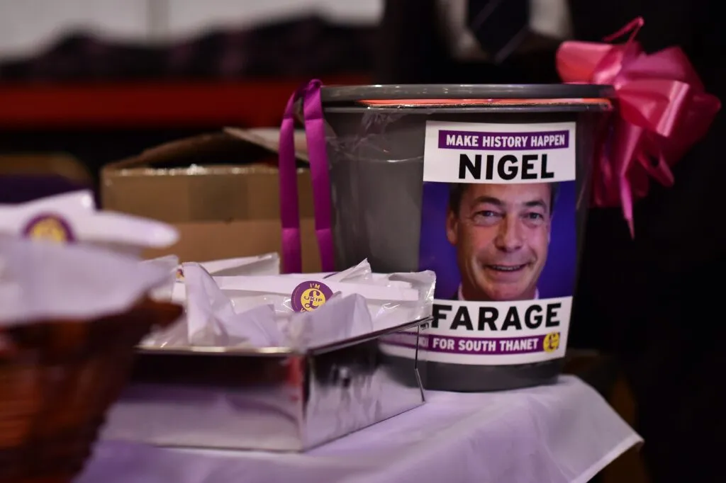 A donations bucket featuring Nigel Farage at a UKIP conference in 2015