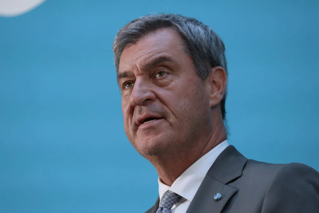 Markus Söder speaking at a podium