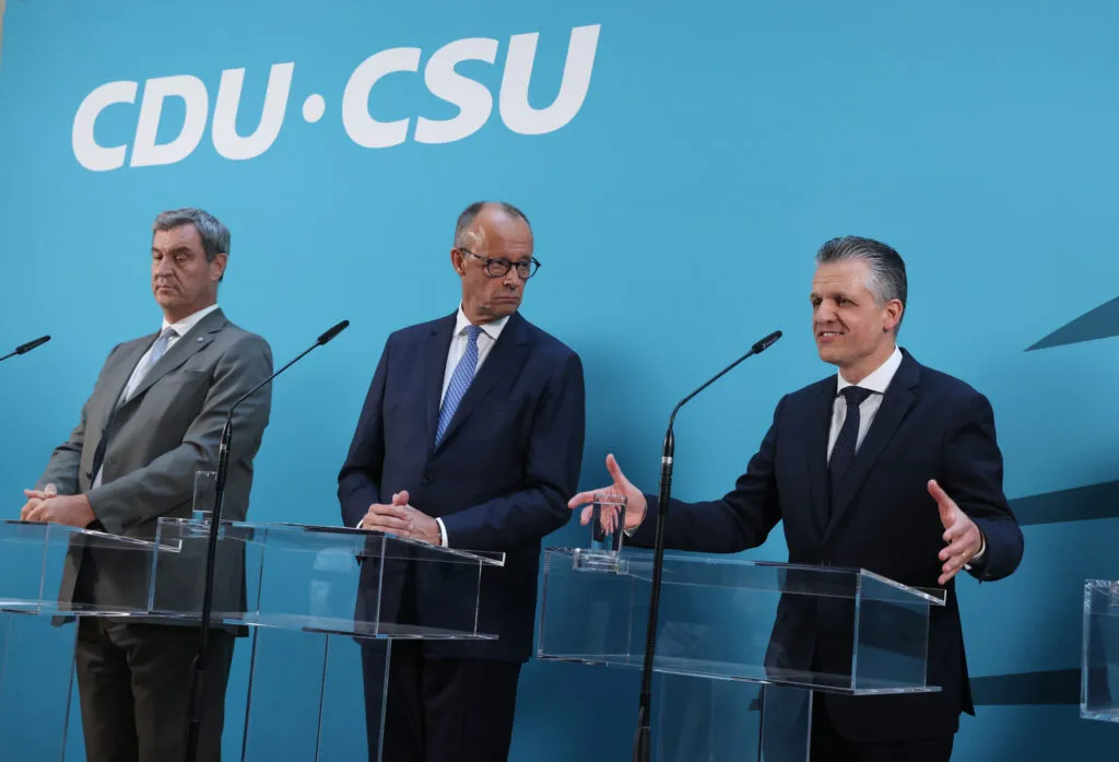 Thorsten Frei, Friedrich Merz and Markus Söder speaking to media in Berlin, July 29, 2026
